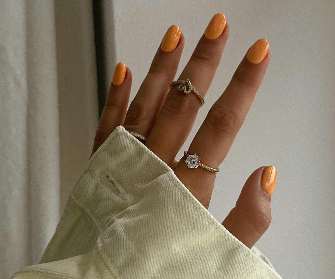 Step-by-step nail care routine with tools laid out on a white surface