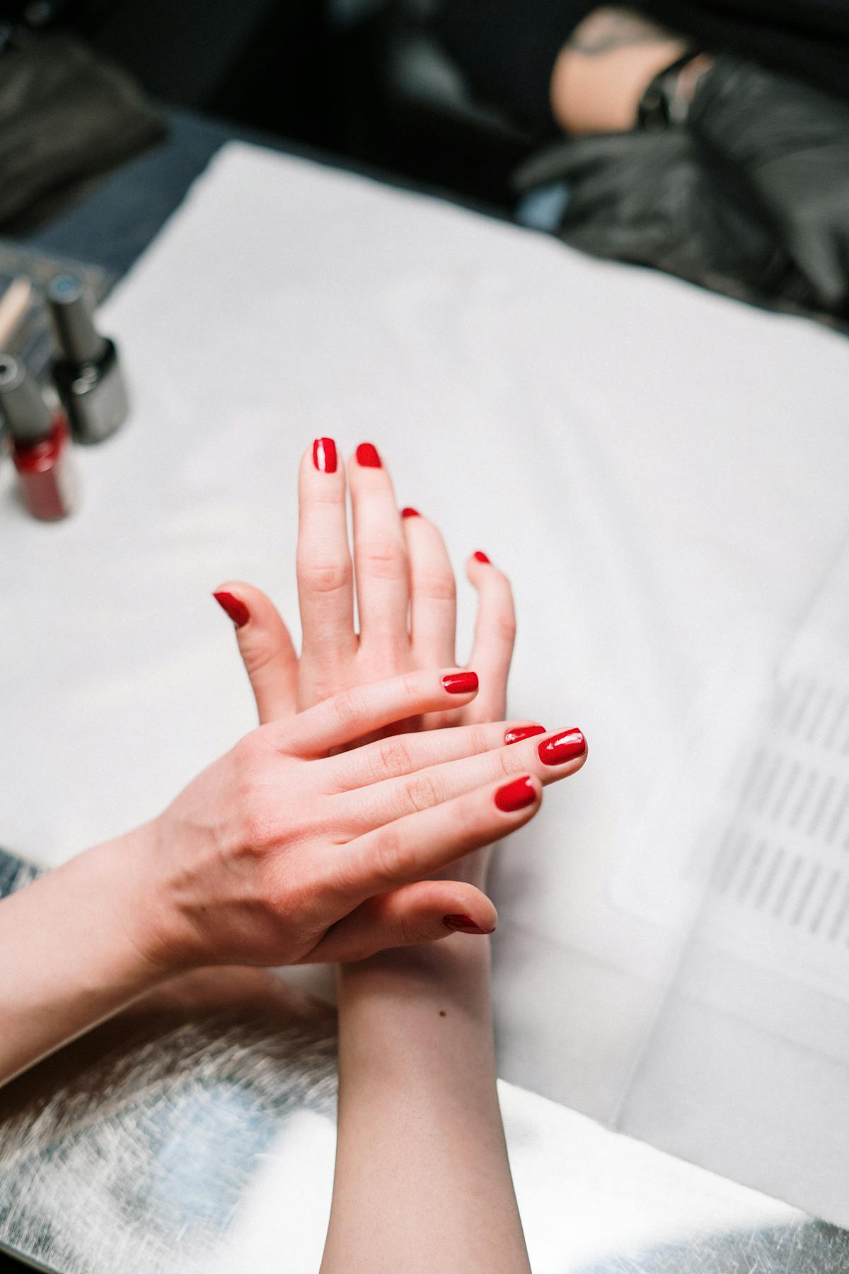 Classic manicure with buff and natural pink polish on well-shaped nails