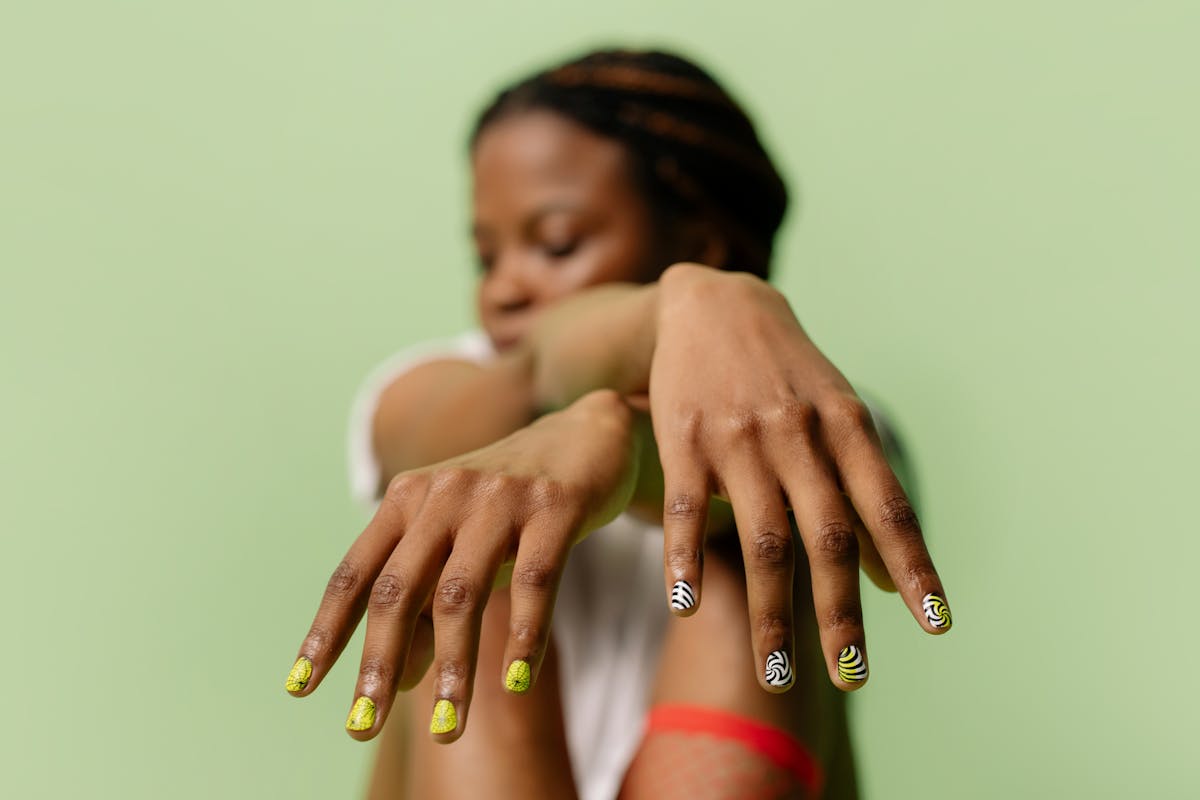 Well-maintained gel manicure on hands showing healthy nail edges and glossy finish